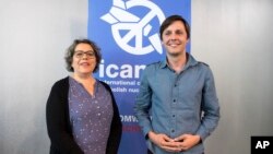 Sascha Hach, right, and Xanthe Hall of the International Campaign to Abolish Nuclear Weapons ICAN Germany, pose in their office in Berlin, Oct. 6, 2017. 