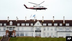 FILE - Then-presidential candidate Donald Trump leaves by his helicopter from the Turnberry golf course in Turnberry, Scotland, Aug. 1, 2015.