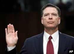 FILE - Former FBI Director James Comey is sworn in during a Senate Intelligence Committee hearing on Capitol Hill in Washington, June 8, 2017. His publisher is moving up the release date of his memoir “A Higher Loyalty,” to April 17.