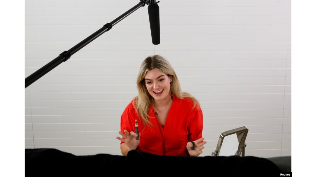 Host Sloane Glass sells beauty products during a Facebook Live event at the QVC Studio Park in West Chester, Pa., June 4, 2018.