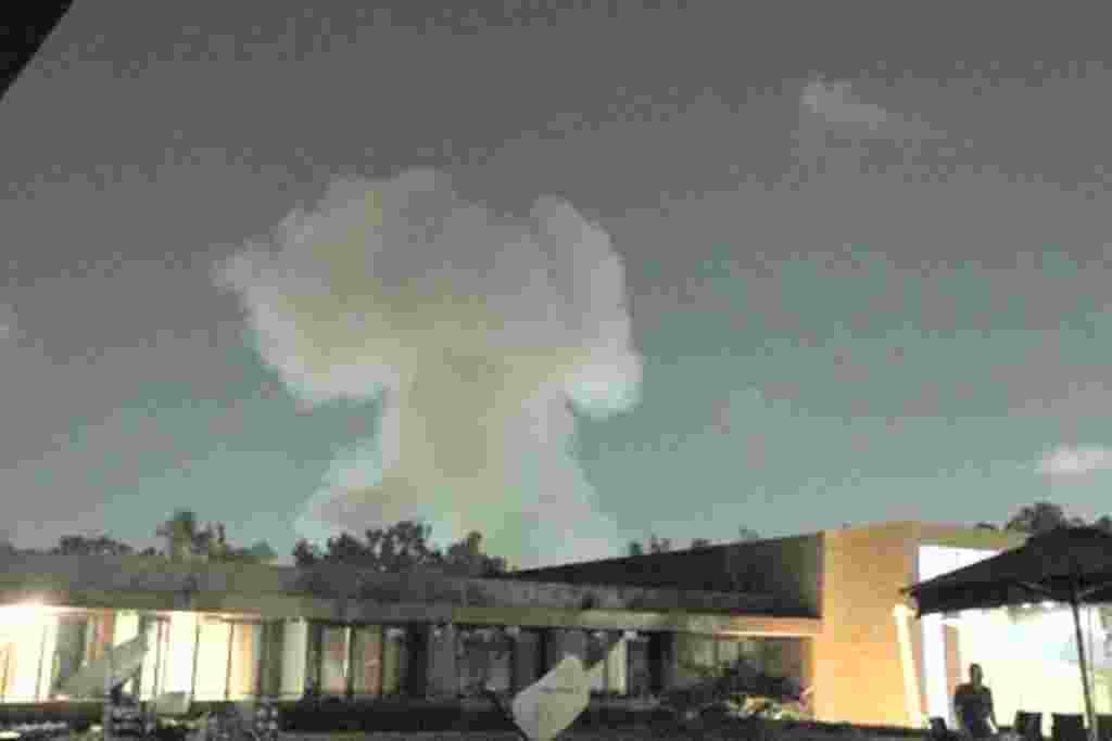 Smoke rises above buildings in Tripoli May 24, 2011.