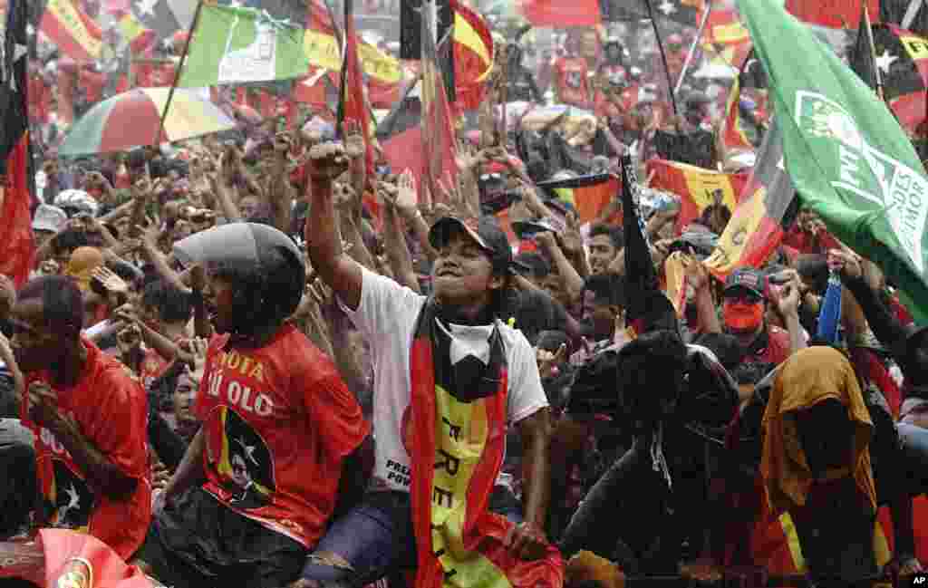 Supporters of incumbent Francisco "Lu-Olo" Guterres from the Fretilin Party, shout slogans during a campaign rally of the presidential election in Dili, East Timor.