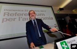 FILE - Lombardy Region President Roberto Maroni arrives for a press conference at the Lombardy Region headquarters, in Milan, Italy, Oct. 22, 2017.