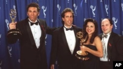 "Seinfeld' cast members, from left, Michael Richards, Jerry Seinfeld, Julia Louise-Dreyfus and Jason Alexander backstage at the Emmy Awards in Pasadena, California, in 1993
