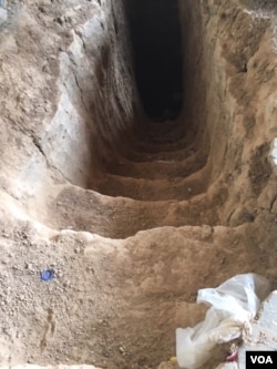 The entrance is shown to one of the many IS-dug tunnels in the village of Wardak, just 20 kms east of Mosul, June 6, 2016. (S. Behn/VOA)