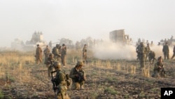 FILE -- Kurdish troops deploy in August 2015 during a military operation to regain control of some villages from the Islamic State south of the oil-rich city of Kirkuk, Iraq. 