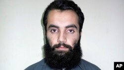 Anis Haqqani, a senior leader of the al-Qaida-linked Haqqani network and a brother of the network's leader Sirajuddin Haqqani, poses for a picture in Kabul, Afghanistan, Oct. 15, 2014.