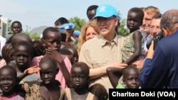 UN Secretary General Ban Ki-moon visits a UN compound in Juba on May 6, 2014, where thousands of displaced people have sought shelter. The hair of many of the children is beginning to turn red, a sign of malnutrition.