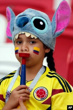 A child wears a jersey of the Colombia's national soccer team prior to the start of the group H match between Poland and Colombia at the 2018 soccer World Cup at the Kazan Arena in Kazan, Russia, Sunday, June 24, 2018. (AP Photo/Frank Augstein)