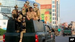 Security forces patrol in Basra, Iraq, 340 miles (550 kilometers) southeast of Baghdad, Sept. 8, 2018. Security forces deployed on the streets of Basra, a day after protesters in the southern city stormed the Iranian consulate and torched government buildings.