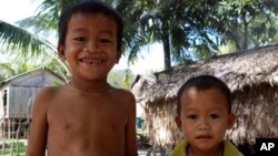 Two S'aoch children in their village in Cambodia. Neither of them speaks S'aoch, 19 Jan 2010