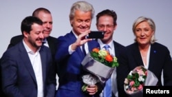 FILE - Netherlands' Party for Freedom (PVV) leader Geert Wilders takes a picture during a European far-right leaders meeting to discuss about the European Union, in Koblenz, Germany, Jan. 21, 2017.