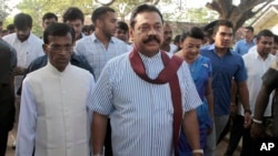 Former Sri Lankan President Mahinda Rajapaksa arrives to cast his vote for president elections.