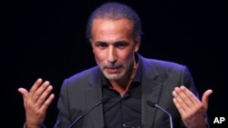 FILE - Prominent Islamic scholar Tariq Ramadan delivers a speech at a French Muslim organization's meeting in Lille, northern France, Feb. 7, 2016.
