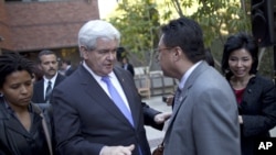 Former Republican presidential candidate Newt Gingrich meets with Asian-Americans during a 2012 campaign stop. Polls suggest Asian-American voters are impacting presidential elections.