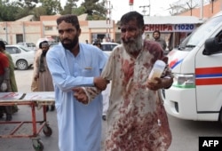 A Pakistani man injured in a bomb blast at an election rally is brought to a hospital in Quetta, July 13, 2018.