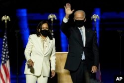 President-elect Joe Biden, right, on stage with Vice President-elect Kamala Harris, left, Saturday, November 7, 2020, in Wilmington, Delaware.  (Photo: AP/Andrew Harnik)