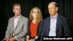 FILE - Jim Piazza, right, seated with his wife Evelyn, center, and son Michael, left, holds back emotions while discussing the death of his son, Penn State University fraternity pledge Tim Piazza, during a 2017 interview in New York. 