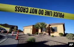 FILE - Police tape blocks off the home of Stephen Craig Paddock in Mesquite, Nevada, Oct. 2, 2017.