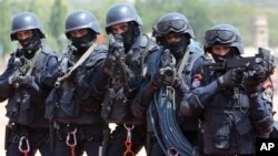 FILE - Indian soldiers of OCTOPUS, or Organization for Counter Terrorist Operations, participate in a parade in Hyderabad, India, June 2, 2015.