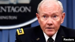 FILE - U.S. Joint Chiefs Chairman General Martin Dempsey speaks to reporters in Washington, Sept. 26, 2014. 