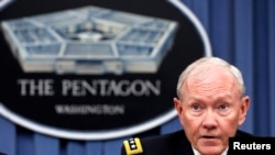 FILE - U.S. Joint Chiefs Chairman General Martin Dempsey speaks to reporters in Washington, Sept. 26, 2014. 