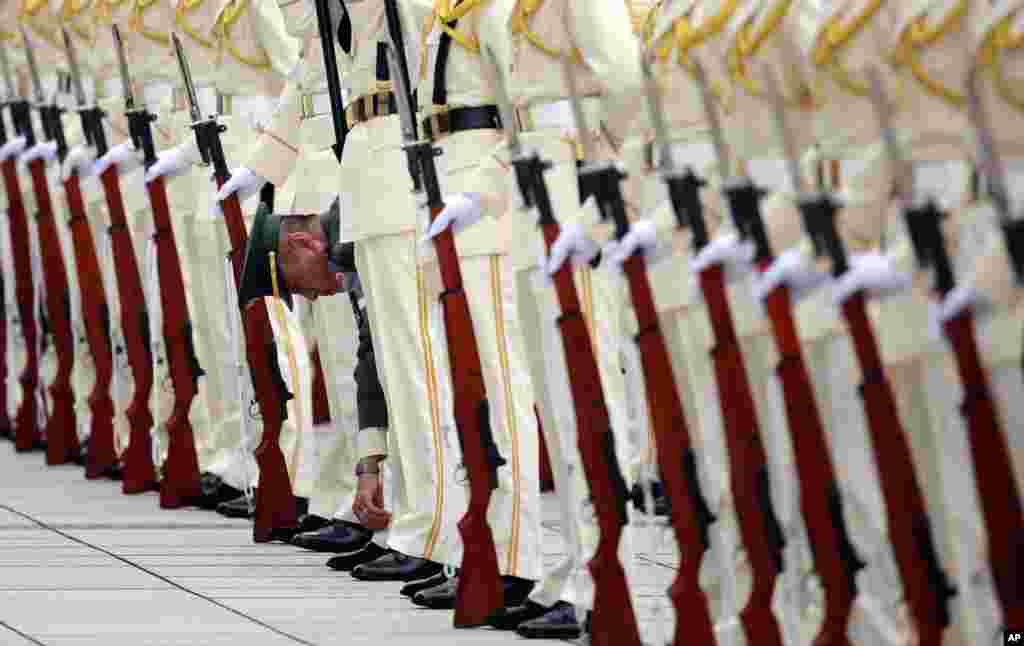 Japan Self-Defense Forces&#39; honor guard prepare to welcome Australian Defense Minister Kevin Andrews and his Japanese counterpart Gen Nakatani to inspect them at the Defense Ministry in Tokyo.