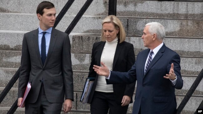 White House senior adviser Jared Kushner, Homeland Security Secretary Kirstjen Nielsen and Vice President Mike Pence talk as they walk down the steps of the Eisenhower Executive Office Building on the White House complex, Jan. 5, 2019, in Washington.