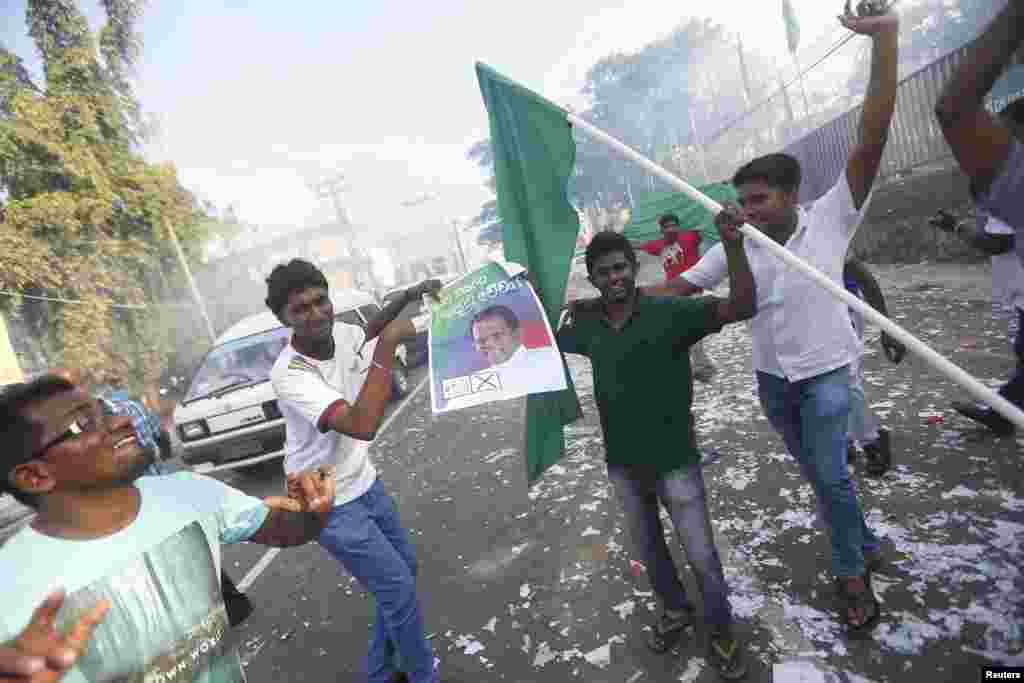 Supporters of Sri Lankan presidential candidate Mithripala Sirisena celebrate in Colombo. Sri Lankan President Mahinda Rajapaksa conceded defeat to Sirisena on Friday, ending a decade of rule that critics say had become increasingly authoritarian and marred by nepotism and corruption.