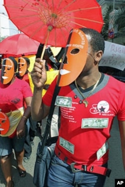 A masked sex worker leads a protest demanding basic human rights, in Nairobi, Kenya, March 6, 2012.