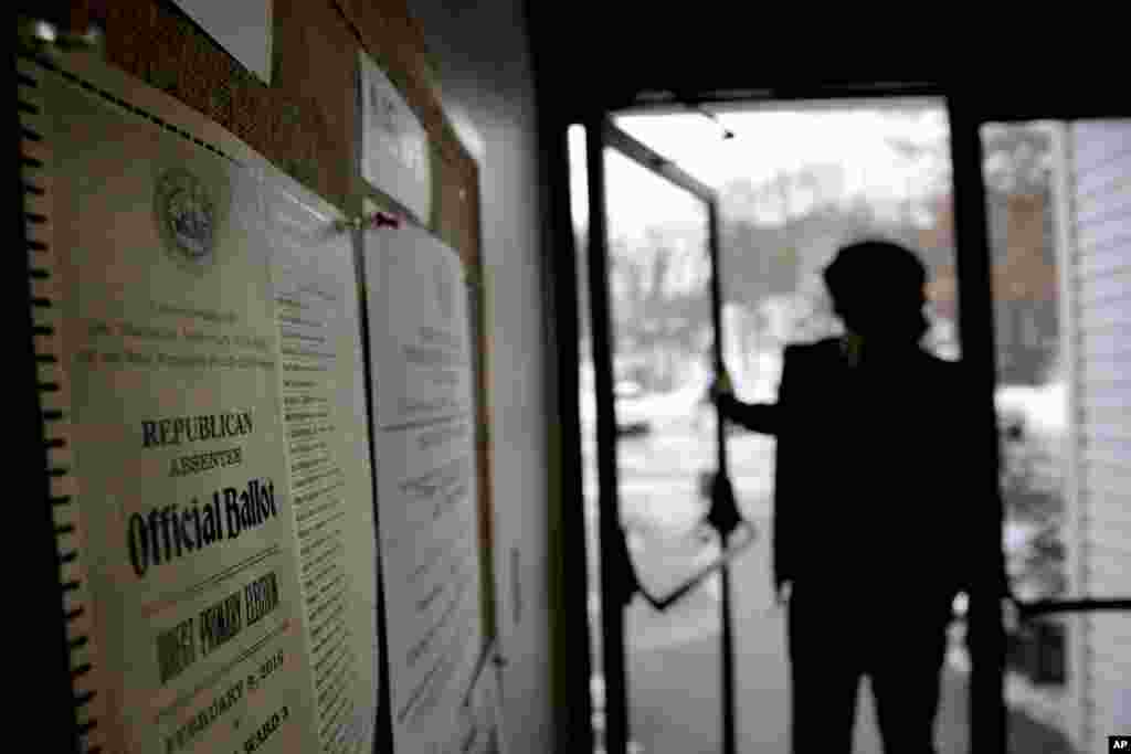 A ballot for the New Hampshire primary is posted to the wall as a voter enters a polling site, Feb. 9, 2016, in Nashua, N.H. 