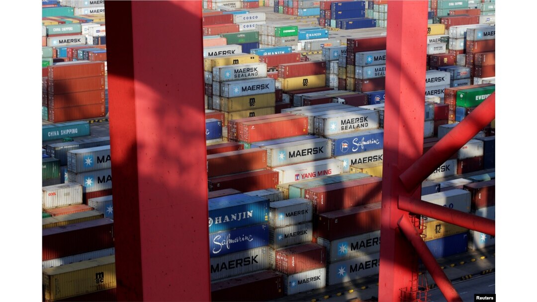 FILE - Containers are seen at the Yangshan Deep Water Port, part of the Shanghai Free Trade Zone, in Shanghai, China, Sept. 24, 2016.