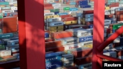 FILE - Containers are seen at the Yangshan Deep Water Port in Shanghai, China, Sept. 24, 2016. 