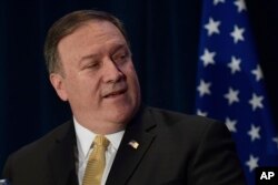 U.S. Secretary of State Mike Pompeo speaks during a press briefing, June 11, 2018 in Singapore one day before President Donald Trump will meet with North Korean leader Kim Jong Un.