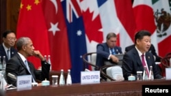 U.S. President Barack Obama watches as Chinese President Xi Jinping speaks at the opening ceremony of the G20 Summit in Hangzhou, Zhejiang province, China, Sept. 4, 2016.