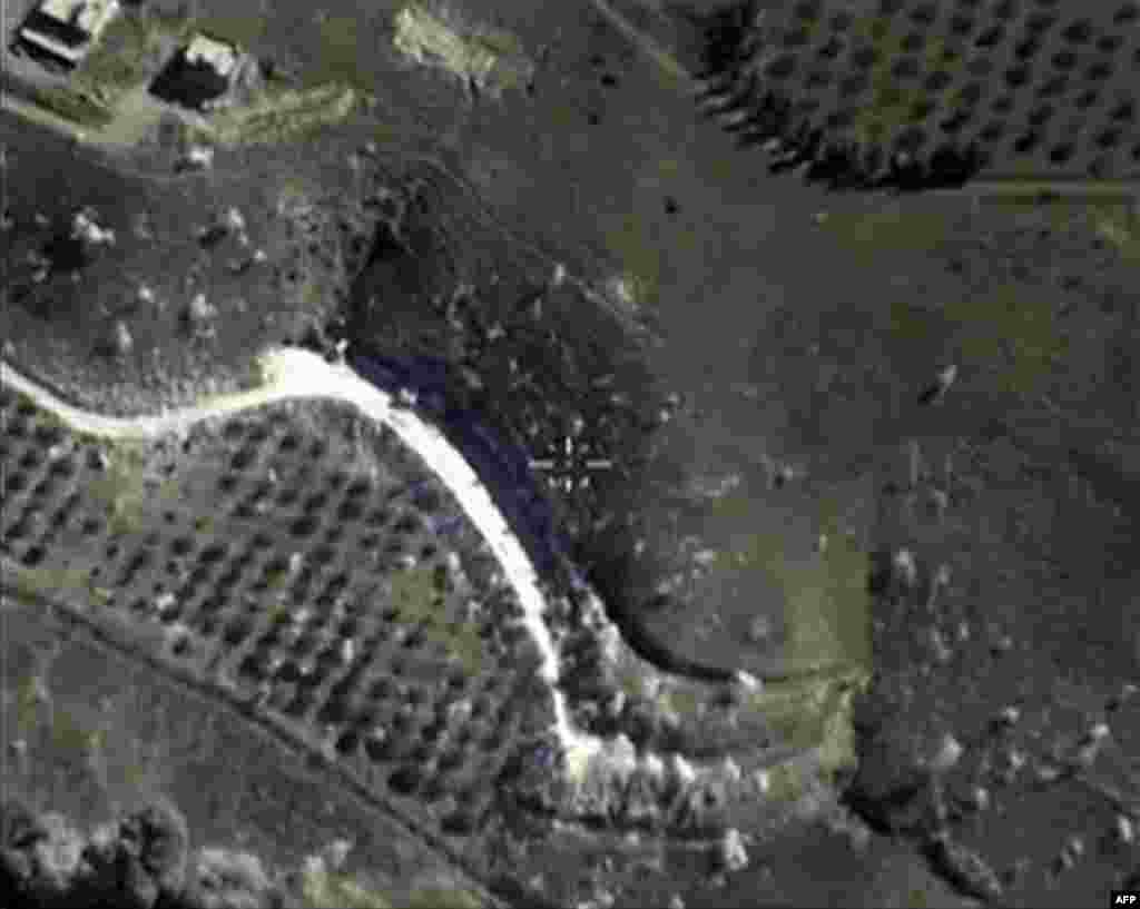 A video grab from Sept. 30, 2015, shows an image made available on the Russian Defense Ministry's official website, purporting to show an airstrike in Syria.