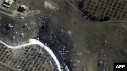 An image from a video made Sept. 30, 2015, and shown on the Russian Defense Ministry's official website, purports to show an airstrike in Syria. 