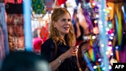 FILE - Actress Nicole Kidman films a scene from the Amazon Prime Video series titled “Expats” in a market in Hong Kong on August 23, 2021.,