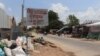 A sign advertising scraps for sale from businessman Mao Tran hangs on a wire in the outskirt of Phnom Penh, Cambodia, April 22, 2020. (Phorn Bopha /VOA Khmer) 