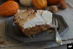 This October 12, 2015 photo shows citrus pumpkin meringue pie in Concord, NH. (AP Photo/Matthew Mead)