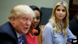 Ivanka Trump, daughter of President Donald Trump, right, and Jessica Johnson, center look to President Trump as he speaks during a meeting with women small business owners in the Roosevelt Room of the White House, in Washington, March 27, 2017.