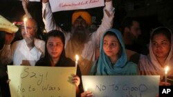 Pakistani civil society activists protest against the recent attacks in Kabul, Afghanistan, which killed many people, in Peshawar, Pakistan, June 3, 2017.