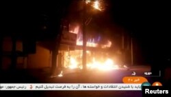 A building on fire is seen in Dorud, Iran, in this still image taken from video on Dec. 31, 2017.