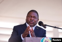 FILE - Mozambique's President Filipe Nyusi speaks during Armed Forces Day celebrations in Pemba, Mozambique, Sept. 25, 2021. Nyusi will step down in January 2025 after his second term. The country's elections are scheduled to be held on Oct. 9, 2024.