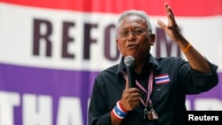 Protest leader Suthep Thaugsuban addresses anti-government protesters in their encampment in central Bangkok, Feb. 25, 2014.