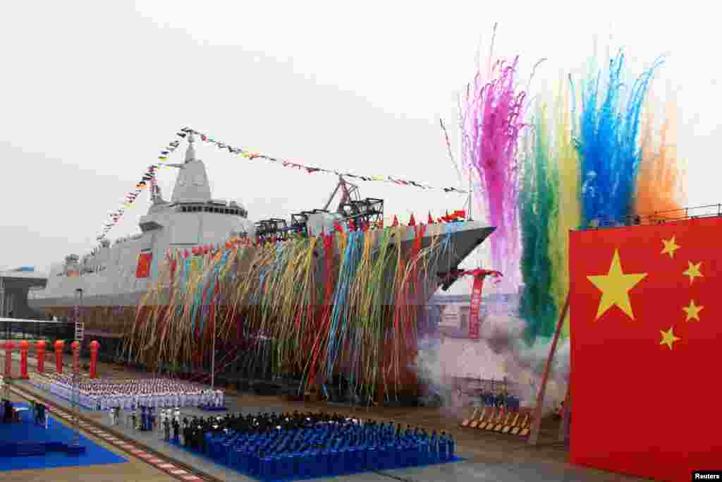 China's new type of domestically-built destroyer, a 10,000-ton warship, is seen during its launching ceremony at the Jiangnan Shipyard in Shanghai, China.