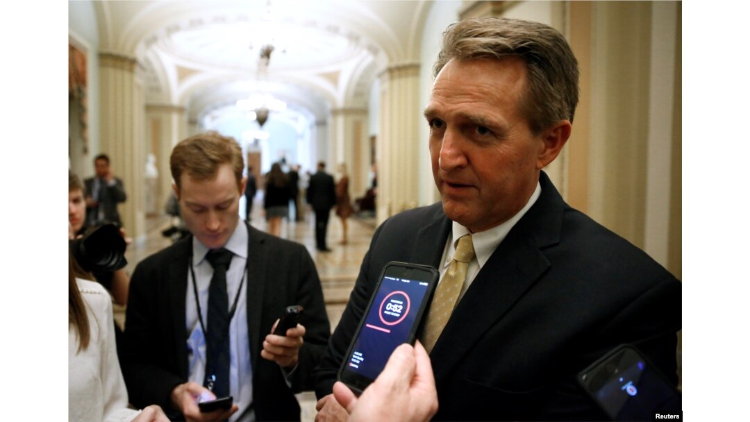 FILE - Senator Jeff Flake, a Republican from Arizona, speaks to reporters on Capitol Hill in Washington, Jan. 22, 2018.