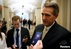 FILE - Senator Jeff Flake (R-AZ) speaks to reporters on Capitol Hill in Washington, Jan. 22, 2018.