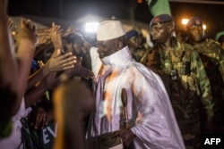 FILEL - Incumbent Gambian President Yahya Jammeh, leader of the APRC (The Alliance for Patriotic Reorientation and Construction) greets his suporters in Bikama, Nov. 24, 2016 during an electoral rally.