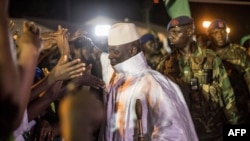 Incumbent Gambian President Yahya Jammeh greets his suporters in Bikama, Nov. 24, 2016 during an electoral rally. 